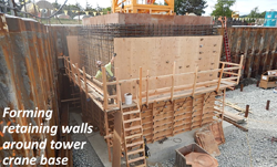 Forming retaining walls around tower crane base