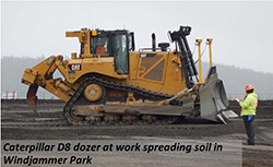 Catepillar D8 dozer at work spreading soil in Windjammer Parm